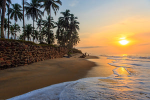 Beautiful sunset on beach in Cape Coast, Ghana with quote by Kwame Nkrumah.